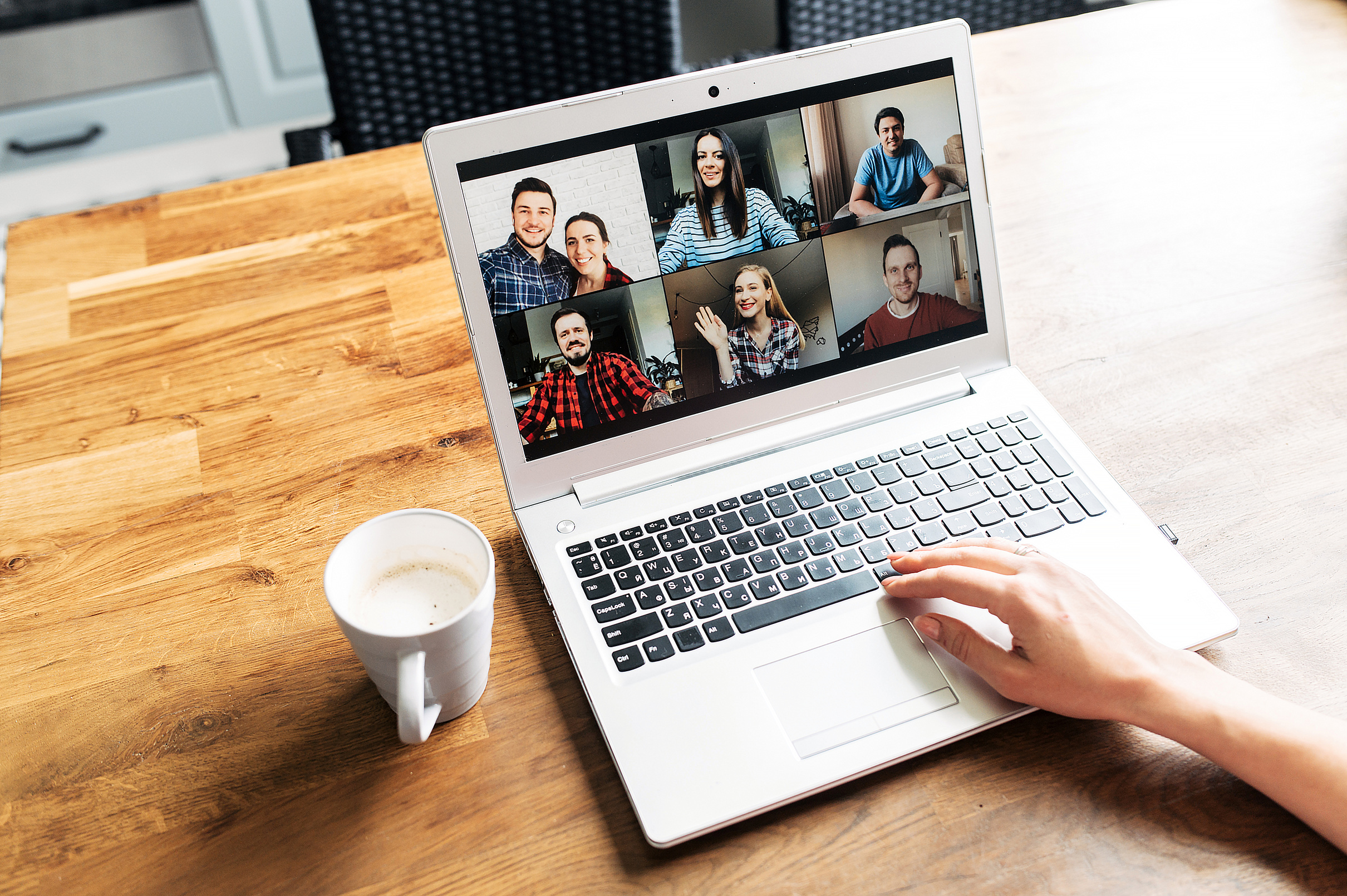 Video meeting on laptop screen, zoom app